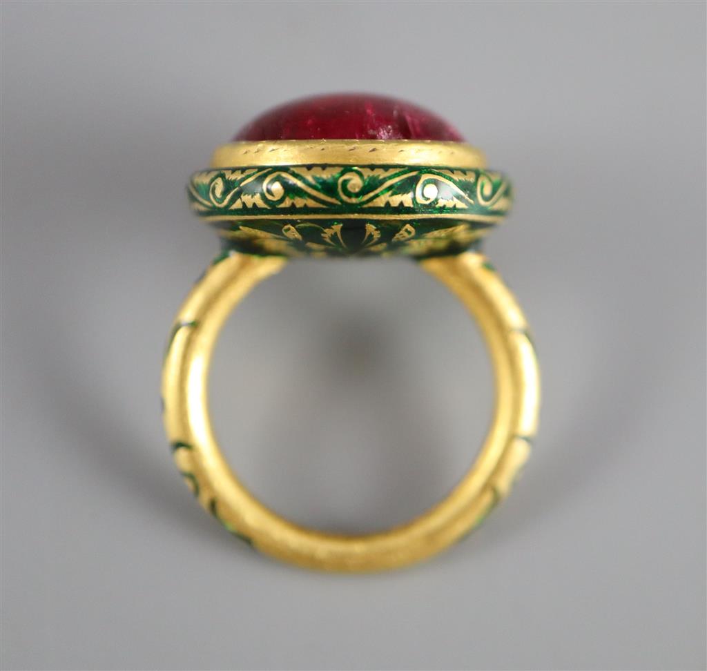 An antique Mogul gold, green enamel and cabochon natural red spinel set ring, size K.